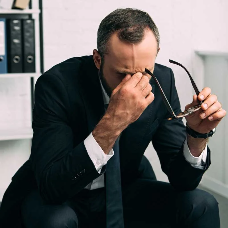 man in suit stressed out